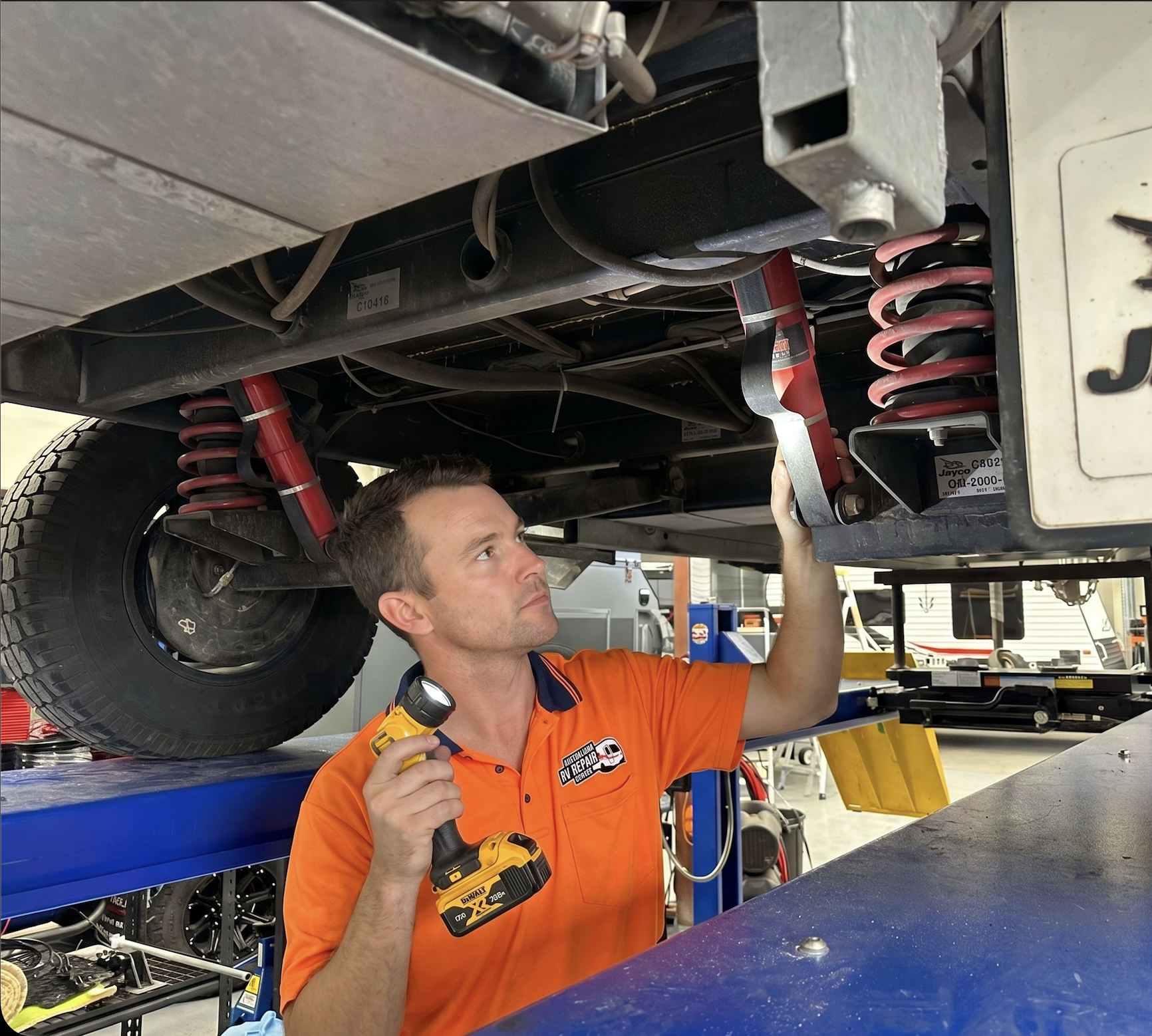 Mechanic inspecting a caravan